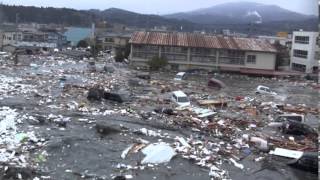 Tsunami in Kesennuma city ascending the Okawa river [upl. by Anahcar]