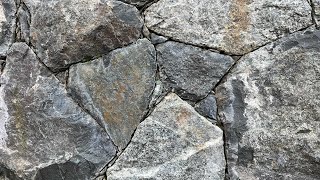 Secrets to creating a beautiful NATURAL STONE WALL Insights from a real stonemason [upl. by Anit654]