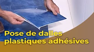 La pose de dalles plastiques adhésives [upl. by Latimore58]